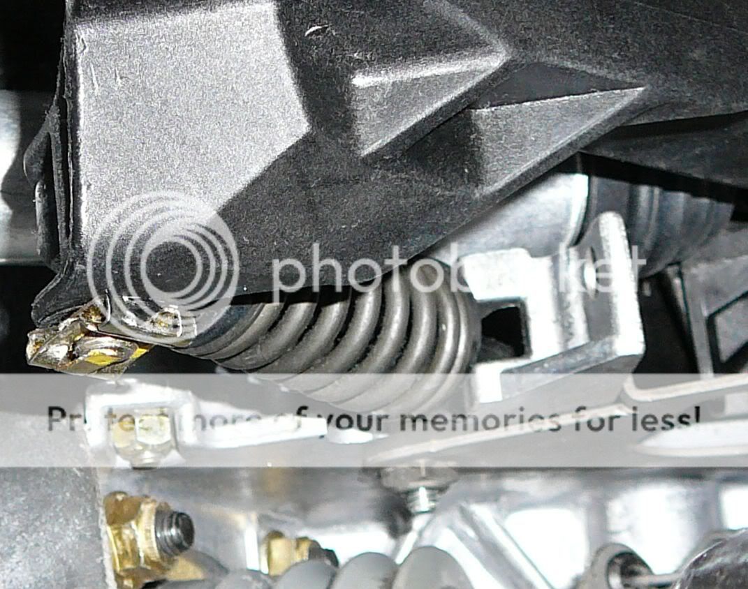 OK, here are the best close-ups I have, though I cannot spot that detail in either! Maybe ask a local Bimmer oriented shop?